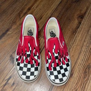 Checkered flame slip on vans